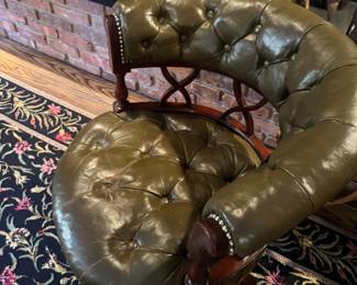 Leather, deep button tufting, curved backrest