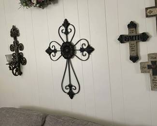 01/24/25 Rosenberg Estate Sale offering numerous crosses located throughout the house, showcasing a variety of designs and decorative finishes.