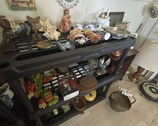 Rosenberg Estate Sale featuring a large collection of unique shelf décor, including assorted decorative accents, figurines, and display pieces.