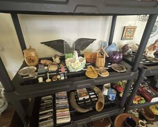 Rosenberg Estate Sale featuring a large collection of unique shelf décor, including assorted decorative accents, figurines, and display pieces.