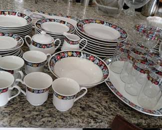 This is a collection of Christopher Stuart (Midnight Garden) Y0035 fine china dinnerware and glassware. 