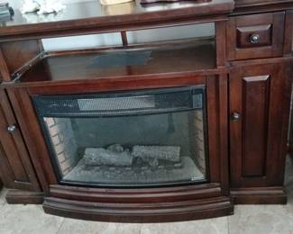 Beautiful TV cabinet or entry way cabinet.Displays Beautiful colors in the foux fireplace.Heater fan blows heat.