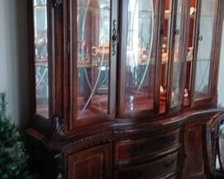 traditional cherry wood china hutch and buffet with glass doors and internal lighting. 