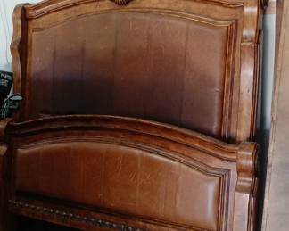 Ashley brand queen size wood bed frame with leather-type inserts