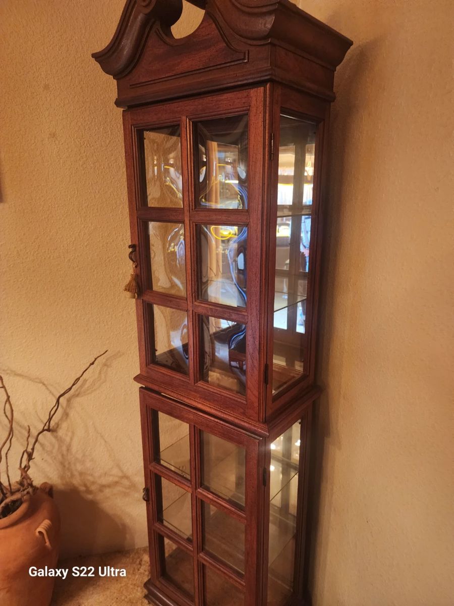 Curio cabinet with convex glass