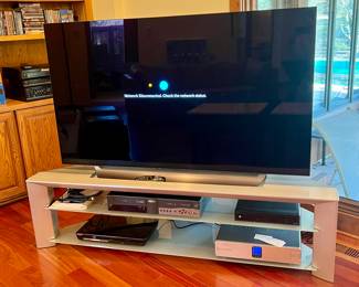 65" LG OLED TV AND ASSORTED ACCESSORIES PERFECTLY FITTED TO THIS CONSOLE STAND