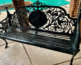 ANTIQUE COALBROOKDALE MEDALLION BENCH...THE PIERCED BACK WITH A CENTRAL CAMEO DEPICTING A ROBED CLASSICAL MAIDEN WIH A BIRD, SURROUNDED BY A FIELD OF TWINING VINES, LEAVES AND BIRDS, THE CLOSED ARMS SIMILARLY MODELED, AND FITTED WITH A METAL SLAT SEAT, RAISED ON SHAPED LEGS WITH SPLAYED FEET