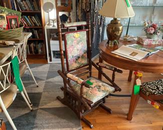 Antique floral and wooden rocking chair. $75 + tax