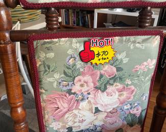 Antique floral and wooden rocking chair. $75 + tax