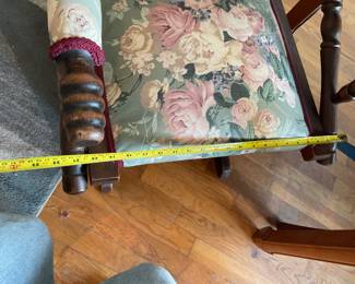 Antique floral and wooden rocking chair. $75 + tax