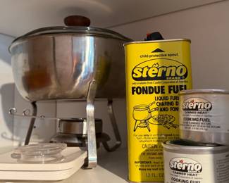 Fondue Pot and Stand, Accompanied by Several Cans of Sterno Brand Cooking Fuel