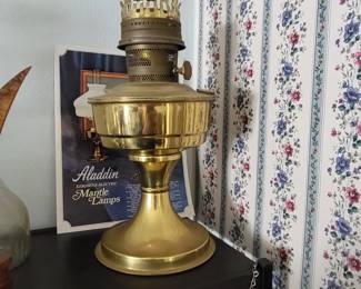 a collectible vintage Aladdin brass kerosene mantle lamp
