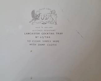 vintage metal serving tray is a Baret Ware piece featuring the "Lancaster" pattern with an "Art Grace" design. 