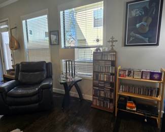 Leather recliner, occasional side table, wall art, and lamp