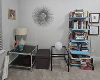 books, records, eye-catching mirror wall art, occasional tables, metal shelf, lamps