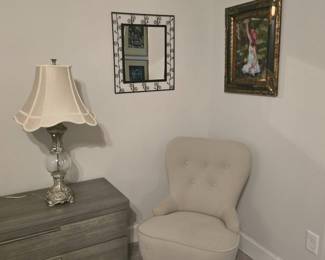upholstered chair, set of crystal lamps, wall decor