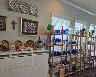 Nick Berkus designer plates with rack, lots of wall art, colorful dishes and so much more!