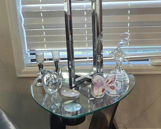 Glass-top side table, chrome lamp, and glass decor (Murano flower-bloom vase)