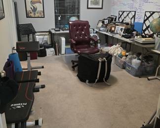office chair, massage chair (in bag), bins and bins of yarn, music stand, workout bench, yoga mats, and picture frames