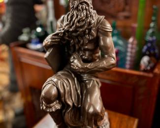 Replica Michelangelo "Moses" Sculpture (the origional was commissioned in 1505 by Pope Julius II for his tomb, it depicts the biblical figure Moses with horns on his head, based on a description in chapter 34 of Exodus in the Vulgate, the Latin translation of the Bible used at that time. Some scholars believe the use of horns may often hold an antisemitic implication, while others hold that it is simply a convention based on the translation error.)