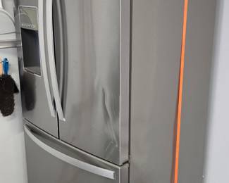Two Door Whirlpool Stainless Refrigerator with Bottom Drawer Freezer (on wheels ready to move)