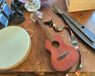 Frame drum; Kala Ukulele; Wooden Dulcimer.