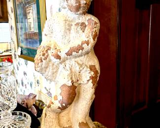 Weathered cherub statue
