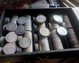 Dozens of Morgan and Liberty dollars