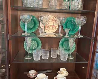 Majelica green plates, Waterford Balloon glasses,           4 different cups and saucers. One from china
and the others are English bone china .. collect
between 1930 - 1970