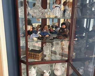 Crystal glass bowl on 2nd shelf: from Germany,  9” tall and 10”long                                                                                        4th shelf: book has been published  several times. It has beautiful engraved portraits.                                                                                       5th shelf: Mix of porcelain pieces unlabeled with the
exception of a number 4440. Likely from between
1870 and 1892 probably in Liege. Could be French
Limoges with inventory number for retailer. Has
some gold trim, simple floral design                                     