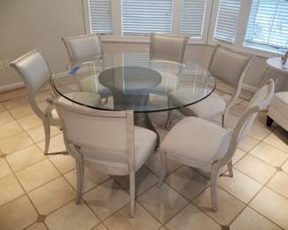 Glass top dining table is 5 feet in diameter. Dining set includes 6 chairs. Dining set $950