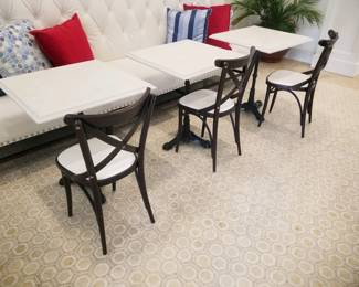 Tufted banquette - white - two available. Banquette is 9 feet, 10 inches long x 52 inches tall x 28 inches deep. Square marble top tables with wrought iron bases are 27 inches x 27 inches x 31 inches tall - 4 tables left. Bistro chairs - 7 available. Banquettes $595 each. Bistro chairs $65 each. Tables $195 each