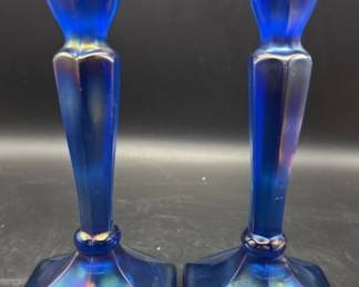 Cobalt iridescent candle stick holders. https://modestlambestatesales.hibid.com/