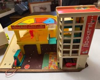 Fisher Price toys. Parking garage. Tool bench.  https://modestlambestatesales.hibid.com/