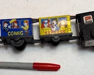 Windup tin train. https://modestlambestatesales.hibid.com/