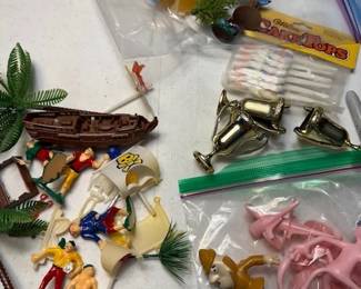 Vintage cake decoration figures.  https://modestlambestatesales.hibid.com/