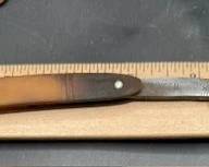 Straight razor. https://modestlambestatesales.hibid.com/