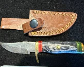 Damascus knives. Leather sheath. https://modestlambestatesales.hibid.com/