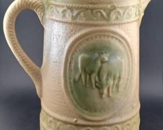 Green cow pitcher antique stoneware made by Hull Pottery. 