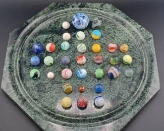 Old marble collection and heavy stone display. 