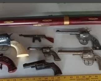 One of many toy cap pistol lots in this auction. 