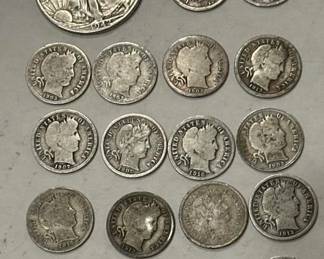 Barber silver dimes and walking liberty half dollar, part of a huge silver coin collection being sold in this auction. 