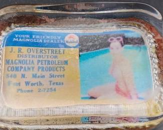 old topless risque paperweight advertising a Magnolia Petroleum gas station in Fort Worth Texas. 