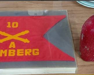 WW2 US artillery unit flag, and a World War 1 US military issue canteen. 