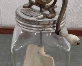 several old butter churns in this auction