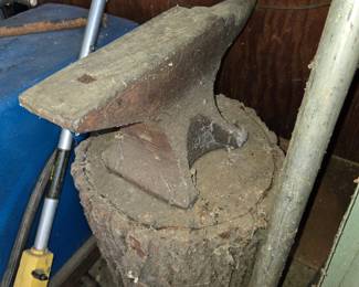 Anvil on log stump