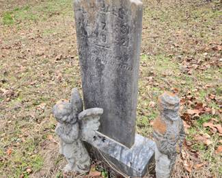 Concrete figures & tombstone