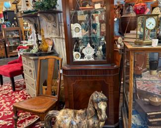 large horse figurine, antique clocks, lamps