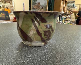 Handmade ceramic bowl or planter with unique glaze featuring green, white and brown glaze pattern