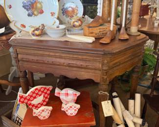 beautiful carved wood end table, small red stool, bird art
